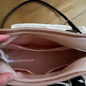 Pink Kate Spade with shoulder strap and black bow